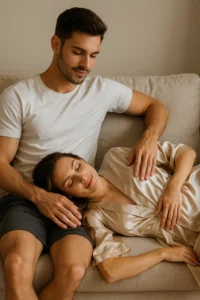Couple relaxing on the couch, sharing a soft and intimate moment that shows the gentle types of foreplay that build connection.